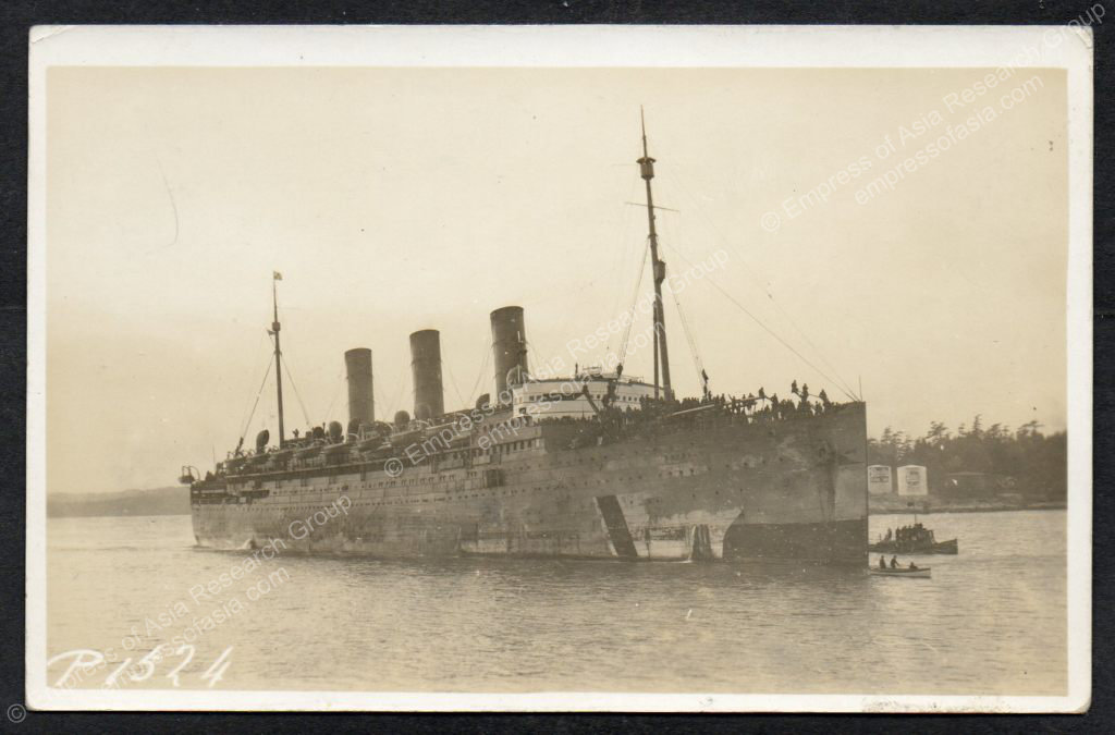The EMPRESS OF ASIA, returning from Europe with Canadian troops, enters Victoria harbour on 24 January 1919.